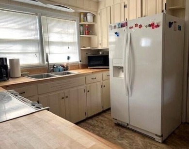 This well maintained 4 BR, 2 BA home is located just inside the - photo 8