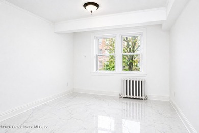 Located at 1879 Haring Street, this full brick end-unit - photo 28