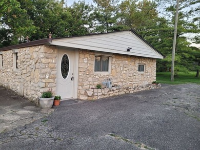 This 1 bed, 1 bath stone home sits on nearly half an acre. It is - photo 2