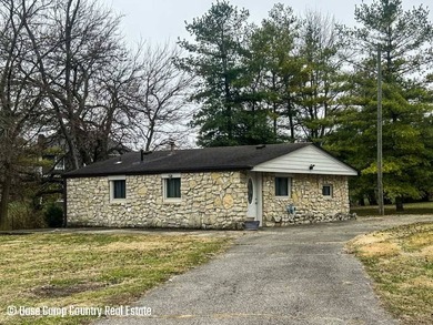 This 1 bed, 1 bath stone home sits on nearly half an acre. It is - photo 3