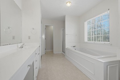 Welcome to 202 Shady Pine Lane, a delightful 3-bedroom, 2-bath