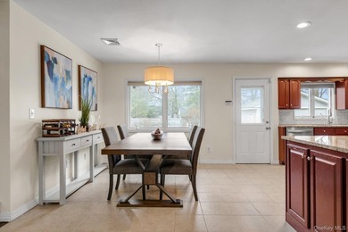 Nestled on a quiet, tree-lined street in a highly desirable - photo 4