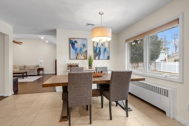 Nestled on a quiet, tree-lined street in a highly desirable - photo 5