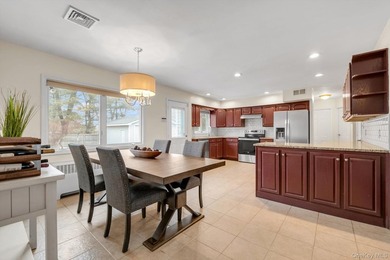 Nestled on a quiet, tree-lined street in a highly desirable - photo 6