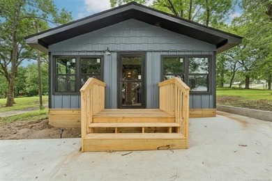 Endless development potential meets modern lakeside living! This - photo 1