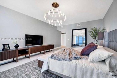 GORGEOUS CORNER 3 BEDROOM RESIDENCE WITH PANORAMIC WATER - photo 8