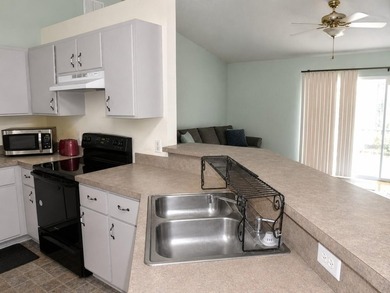 Welcome to Silver Springs Shores! This inviting 3-bedroom - photo 6