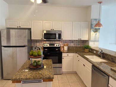 You'll love this FIRST FLOOR CONDO in the beautiful gated