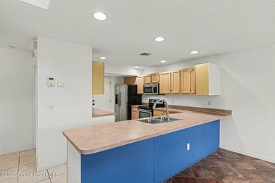 Centrally located in Titusville, this 2-bedroom, 2.5-bath - photo 11