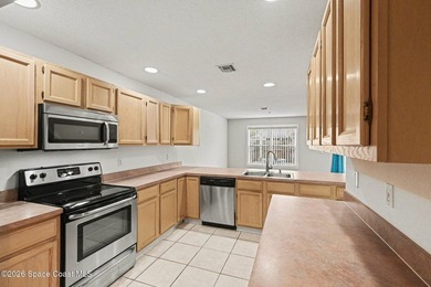 Centrally located in Titusville, this 2-bedroom, 2.5-bath - photo 13