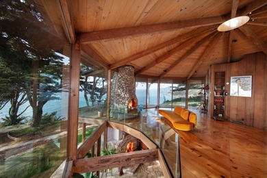 This oceanside sanctuary is set on a private forested promontory - photo 1