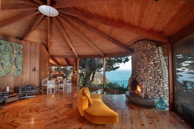 This oceanside sanctuary is set on a private forested promontory - photo 4