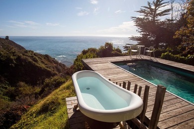 This oceanside sanctuary is set on a private forested promontory - photo 9