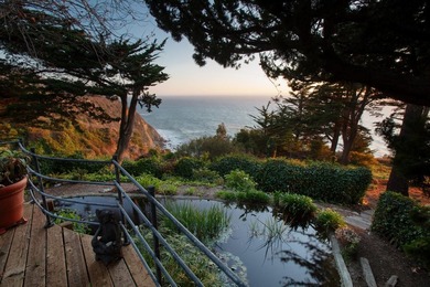 This oceanside sanctuary is set on a private forested promontory - photo 10