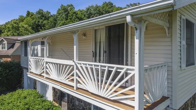 Enjoy lake views and flexible living space in this charming - photo 2