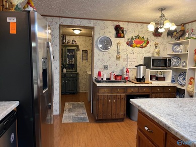 Country charm meets modern comfort! Nestled on 2 +- acres with a