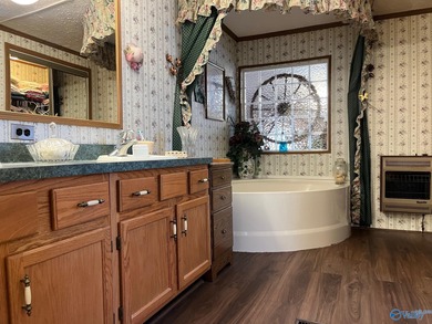 Country charm meets modern comfort! Nestled on 2 +- acres with a