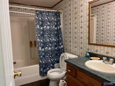 Country charm meets modern comfort! Nestled on 2 +- acres with a