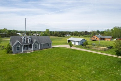Tucked off the road on 4 peaceful acres, this 2005 custom ranch - photo 2