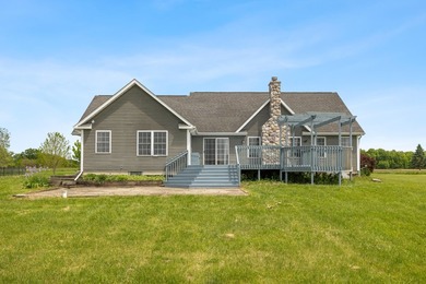 Tucked off the road on 4 peaceful acres, this 2005 custom ranch - photo 3