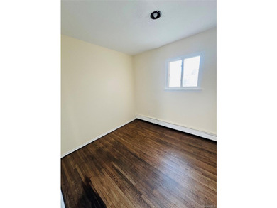 High Ranch With Updated Kitchen And Large Living Room. Hardwood - photo 9