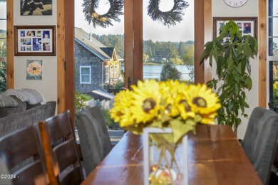 Sophisticated coastal living overlooking Devils Lake, set on a - photo 12