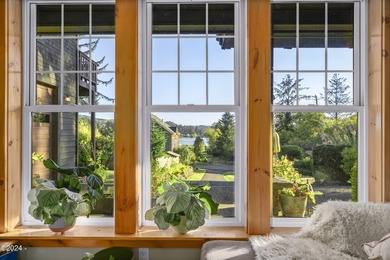 Sophisticated coastal living overlooking Devils Lake, set on a - photo 17