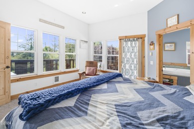 Sophisticated coastal living overlooking Devils Lake, set on a - photo 21