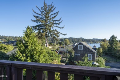 Sophisticated coastal living overlooking Devils Lake, set on a - photo 23