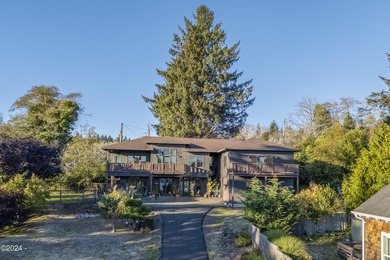 Sophisticated coastal living overlooking Devils Lake, set on a - photo 53