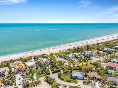 Nestled along the majestic shoreline on Sanibel, this beautiful - photo 1