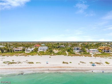 Nestled along the majestic shoreline on Sanibel, this beautiful - photo 2