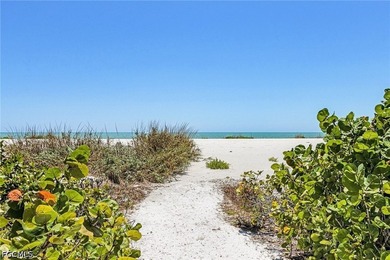 Nestled along the majestic shoreline on Sanibel, this beautiful - photo 4