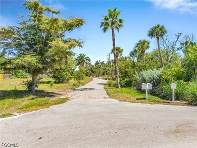 Nestled along the majestic shoreline on Sanibel, this beautiful - photo 6