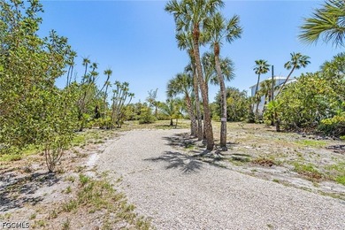 Nestled along the majestic shoreline on Sanibel, this beautiful - photo 7