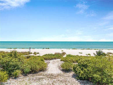 Nestled along the majestic shoreline on Sanibel, this beautiful - photo 9