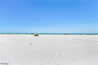 Nestled along the majestic shoreline on Sanibel, this beautiful - photo 10