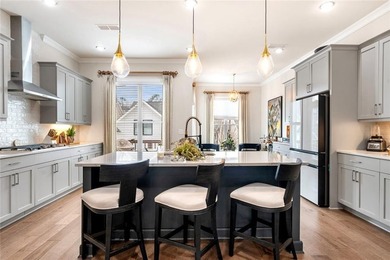 Welcome to this beautifully upgraded three-level townhouse