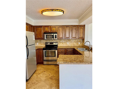 This 2-bedroom, 2-bathroom condo in the heart of the gated - photo 8