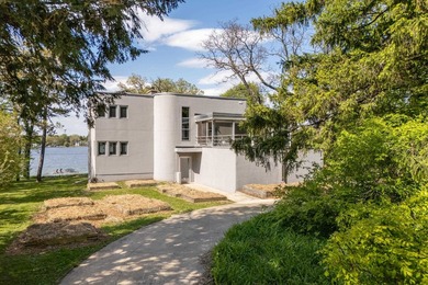 Set along a remarkable stretch of Lake Monona shoreline, this - photo 2