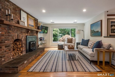 Set gracefully on a beautifully landscaped property framed by - photo 13