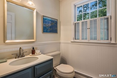 Set gracefully on a beautifully landscaped property framed by - photo 17