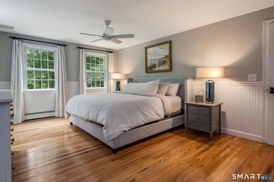 Set gracefully on a beautifully landscaped property framed by - photo 18