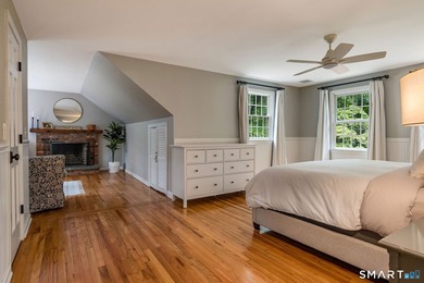 Set gracefully on a beautifully landscaped property framed by - photo 19