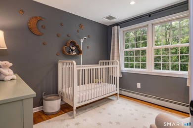 Set gracefully on a beautifully landscaped property framed by - photo 22