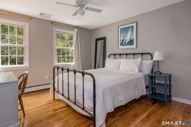 Set gracefully on a beautifully landscaped property framed by - photo 24
