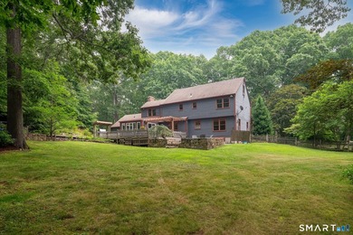 Set gracefully on a beautifully landscaped property framed by - photo 27