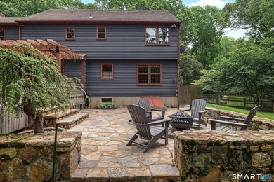 Set gracefully on a beautifully landscaped property framed by - photo 28