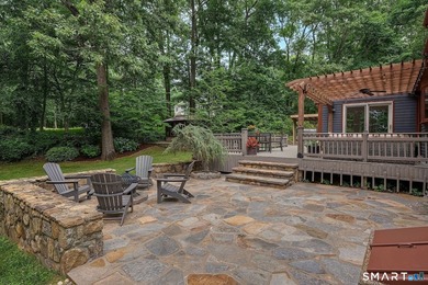 Set gracefully on a beautifully landscaped property framed by - photo 29