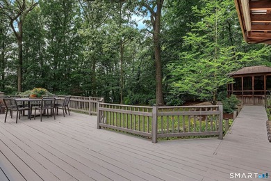 Set gracefully on a beautifully landscaped property framed by - photo 32
